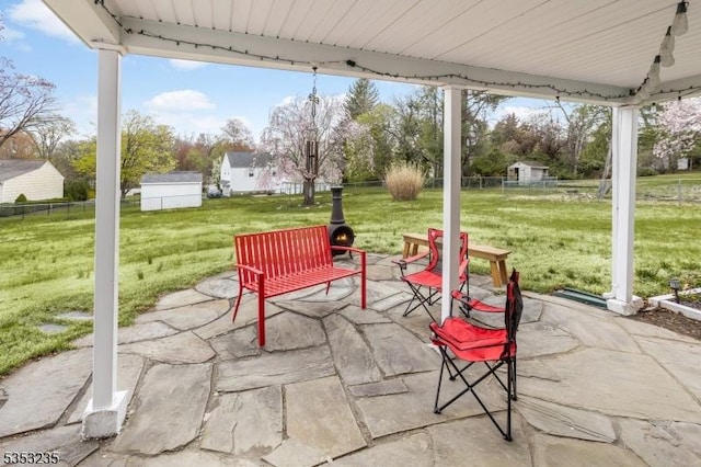 view of patio featuring fence