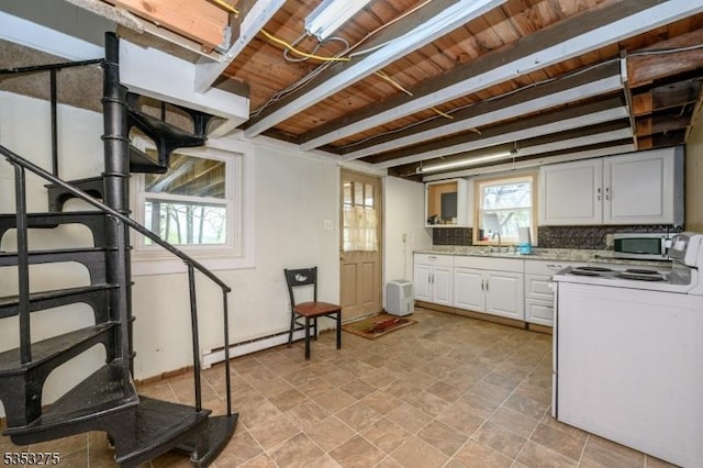 kitchen featuring white electric stove, stainless steel microwave, wood ceiling, beam ceiling, and backsplash