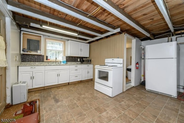 kitchen with white appliances, wooden ceiling, beam ceiling, white cabinetry, and a sink
