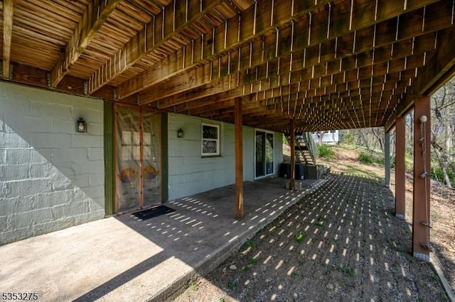 view of patio featuring stairway