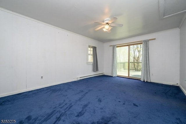empty room with a baseboard heating unit, ornamental molding, dark carpet, a ceiling fan, and baseboards