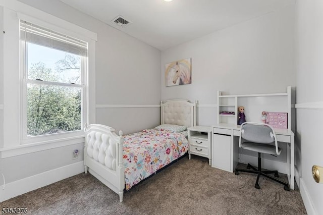 carpeted bedroom featuring visible vents and multiple windows