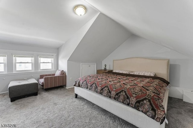 carpeted bedroom featuring vaulted ceiling