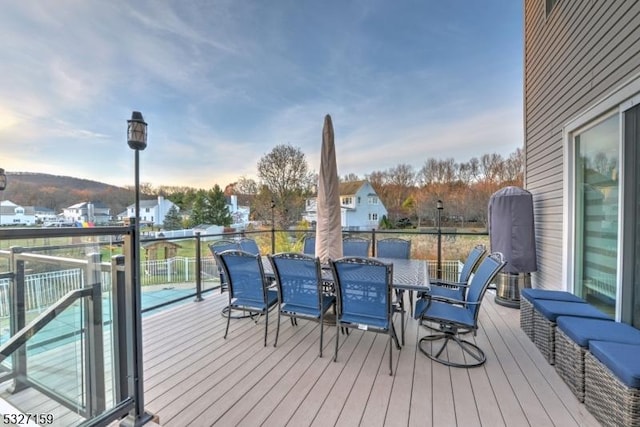 wooden deck with outdoor dining space