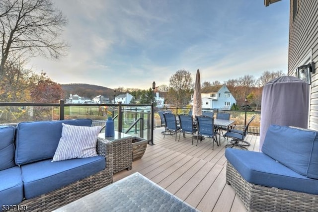 deck with outdoor dining space and outdoor lounge area