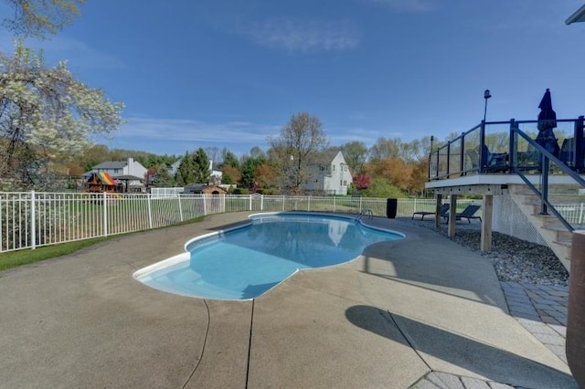 view of pool featuring a patio, a fenced in pool, and fence