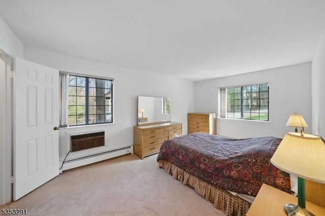 bedroom featuring a wall mounted air conditioner, a baseboard heating unit, and carpet flooring