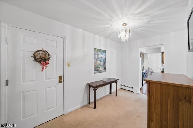 entrance foyer featuring a baseboard heating unit, a chandelier, light carpet, and baseboards