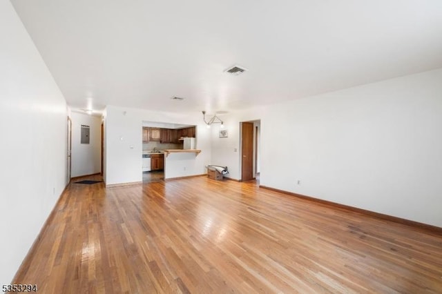 1250 N Broad St Unit A1, Hillside Twp, NJ 07205 - unfurnished living room with baseboards, visible vents, and light wood finished floors
