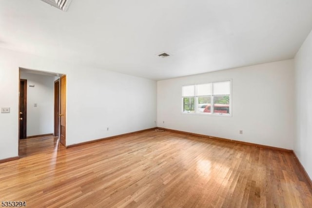 1250 N Broad St Unit A1, Hillside Twp, NJ 07205 - unfurnished room with baseboards, visible vents, and light wood finished floors