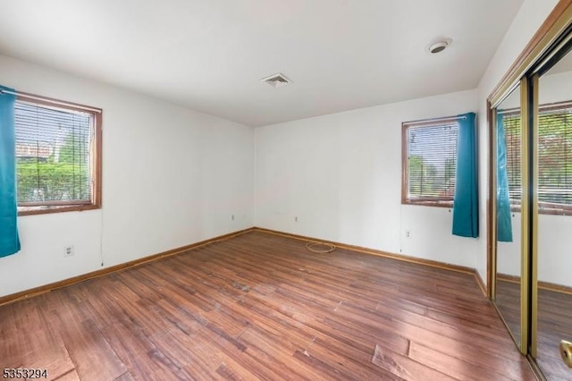1250 N Broad St Unit A1, Hillside Twp, NJ 07205 - unfurnished room featuring baseboards, plenty of natural light, and wood finished floors