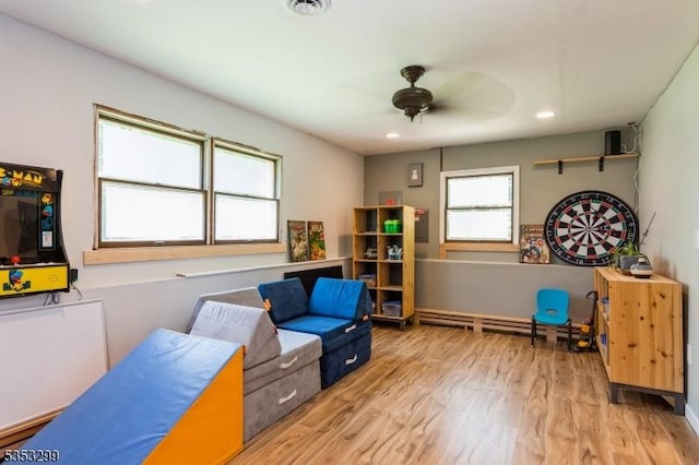 1231 Sunnyfield Ln, Scotch Plains Twp, NJ 07076 - playroom with wood finished floors, a ceiling fan, a baseboard radiator, and recessed lighting