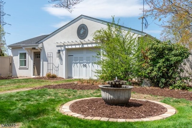 exterior space featuring a yard and stucco siding