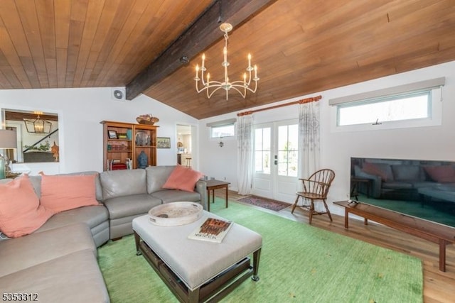 living room with wooden ceiling, a notable chandelier, vaulted ceiling with beams, french doors, and wood finished floors
