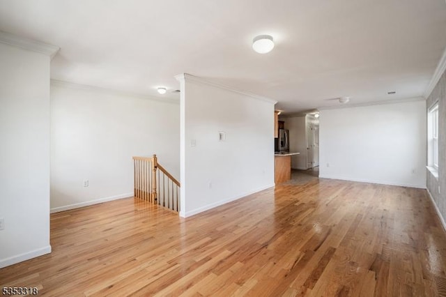 452 Fulton St, Elizabeth City, NJ 07206 - spare room featuring ornamental molding, light wood-style floors, and baseboards