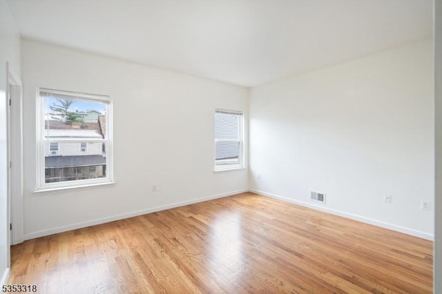452 Fulton St, Elizabeth City, NJ 07206 - spare room featuring light wood-type flooring and baseboards