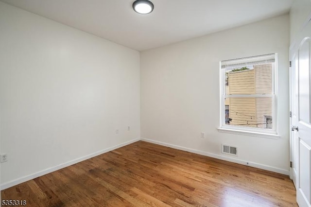 452 Fulton St, Elizabeth City, NJ 07206 - spare room featuring wood finished floors and baseboards
