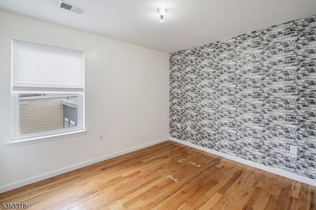 452 Fulton St, Elizabeth City, NJ 07206 - spare room featuring wood finished floors and baseboards