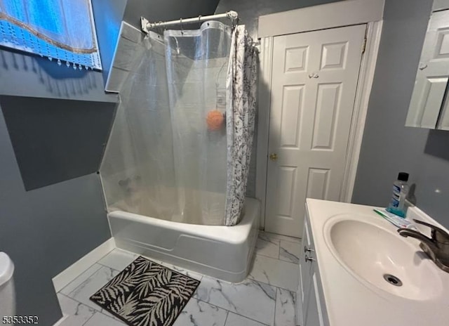 full bathroom with vanity, marble finish floor, baseboards, and shower / bath combination with curtain