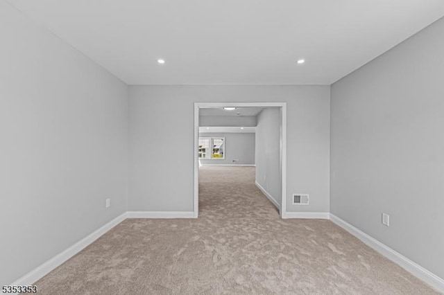unfurnished room featuring carpet floors, recessed lighting, and baseboards