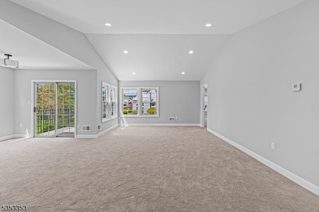 carpeted spare room featuring lofted ceiling, baseboards, and recessed lighting