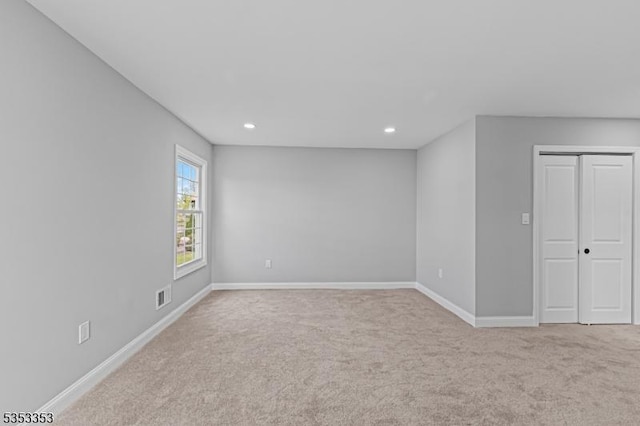 unfurnished bedroom with carpet, baseboards, recessed lighting, and a closet