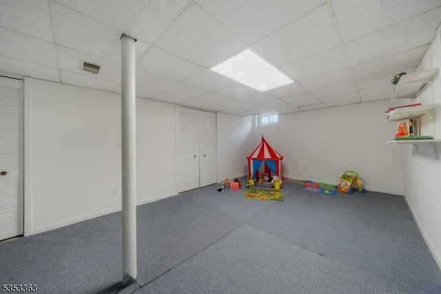 recreation room featuring visible vents, carpet, and a paneled ceiling