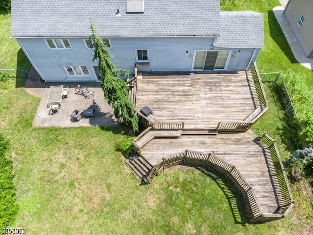 back of house with a lawn, a patio, and a deck