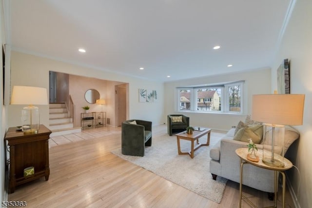 living room with stairs, recessed lighting, and wood finished floors