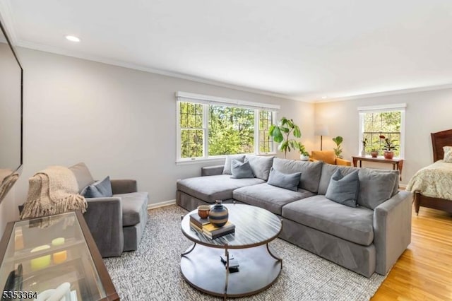 living area featuring recessed lighting, ornamental molding, and a wealth of natural light