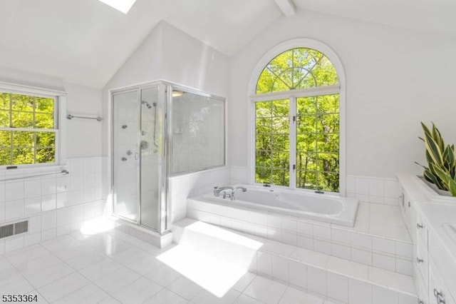 full bath featuring visible vents, vaulted ceiling with beams, a bath, tile patterned floors, and a stall shower