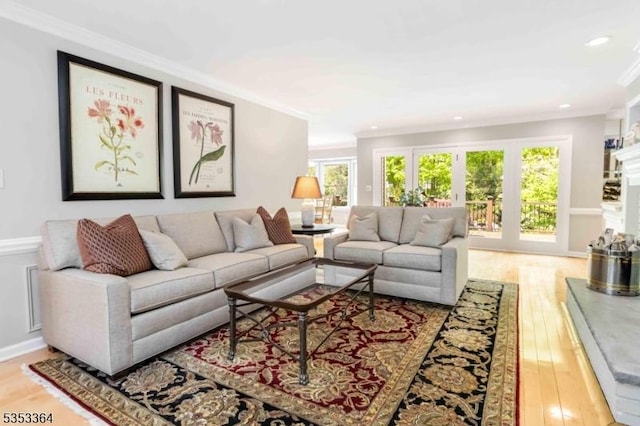 living room featuring crown molding, recessed lighting, and wood finished floors