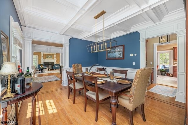 14 Jenny Ln, Vernon Twp, NJ 07461 - dining space featuring a decorative wall, coffered ceiling, decorative columns, and light wood-style floors
