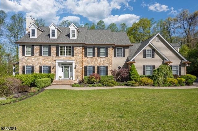14 Jenny Ln, Vernon Twp, NJ 07461 - view of front of house with a chimney, a front yard, and stone siding