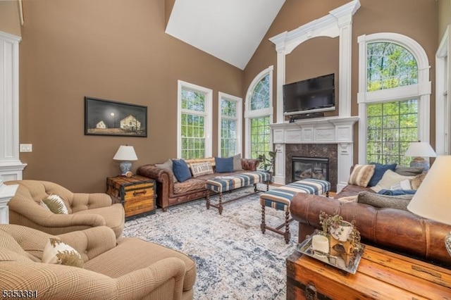 14 Jenny Ln, Vernon Twp, NJ 07461 - living area with a high end fireplace, high vaulted ceiling, and decorative columns