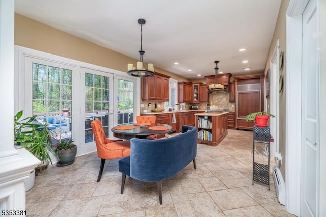 14 Jenny Ln, Vernon Twp, NJ 07461 - dining room with stone finish flooring, a chandelier, recessed lighting, and a baseboard radiator