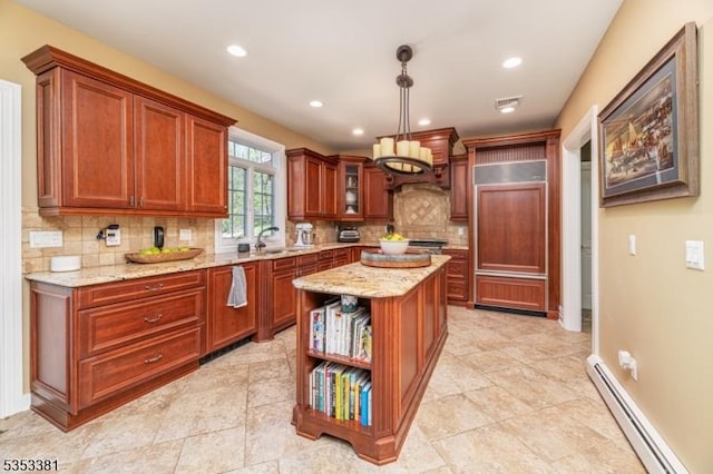 14 Jenny Ln, Vernon Twp, NJ 07461 - kitchen featuring a sink, a baseboard radiator, light stone countertops, and backsplash