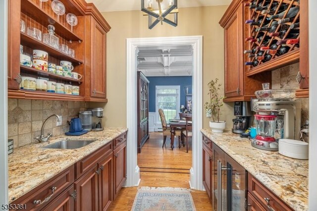 14 Jenny Ln, Vernon Twp, NJ 07461 - bar featuring tasteful backsplash, a sink, beverage cooler, coffered ceiling, and light wood-style flooring