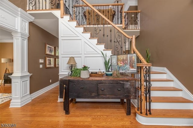 14 Jenny Ln, Vernon Twp, NJ 07461 - stairs featuring baseboards, decorative columns, and wood finished floors
