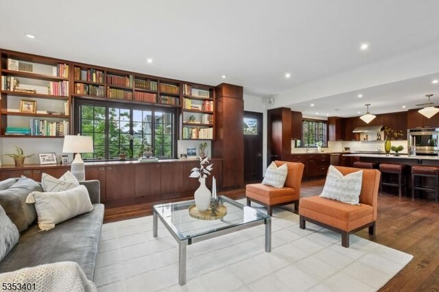 living area featuring wood finished floors and recessed lighting