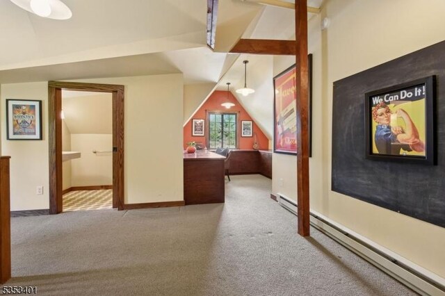 bonus room with vaulted ceiling, a baseboard heating unit, carpet floors, baseboards, and a desk