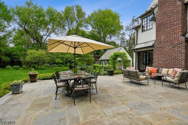view of patio / terrace featuring an outdoor living space and outdoor dining area