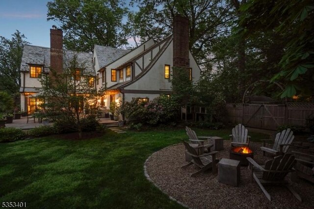 view of yard with a fire pit and a patio