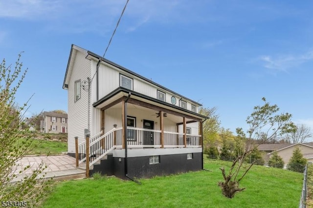 traditional-style house with a front yard and a patio area