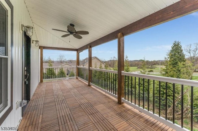 wooden deck featuring ceiling fan
