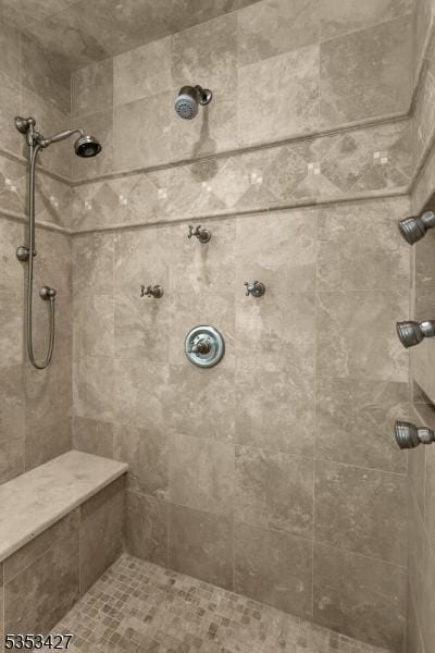 bathroom featuring a tile shower