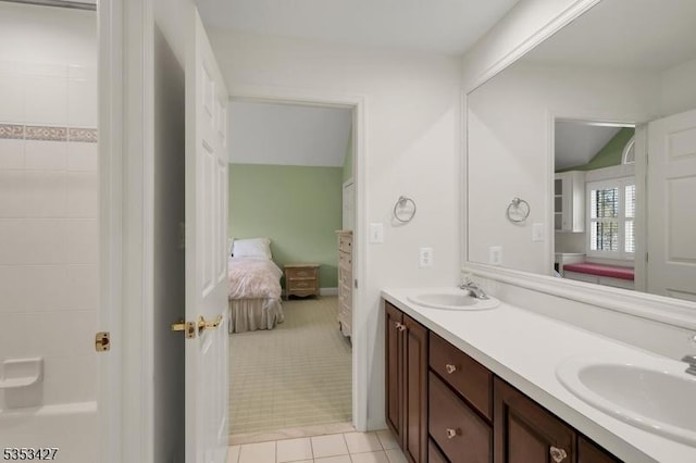 full bathroom with tile patterned floors, a sink, and ensuite bath