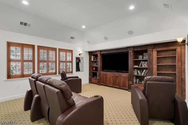 living area with baseboards and visible vents