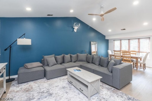 living room featuring visible vents, a ceiling fan, vaulted ceiling, and recessed lighting