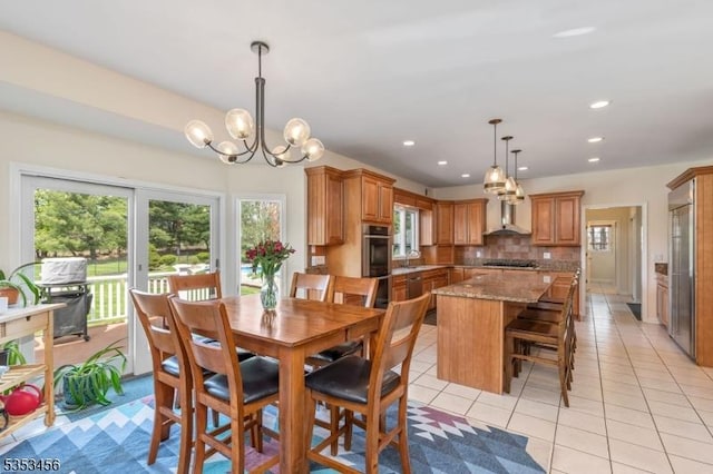 dining room featuring recessed lighting, a chandelier, and light tile patterned floors